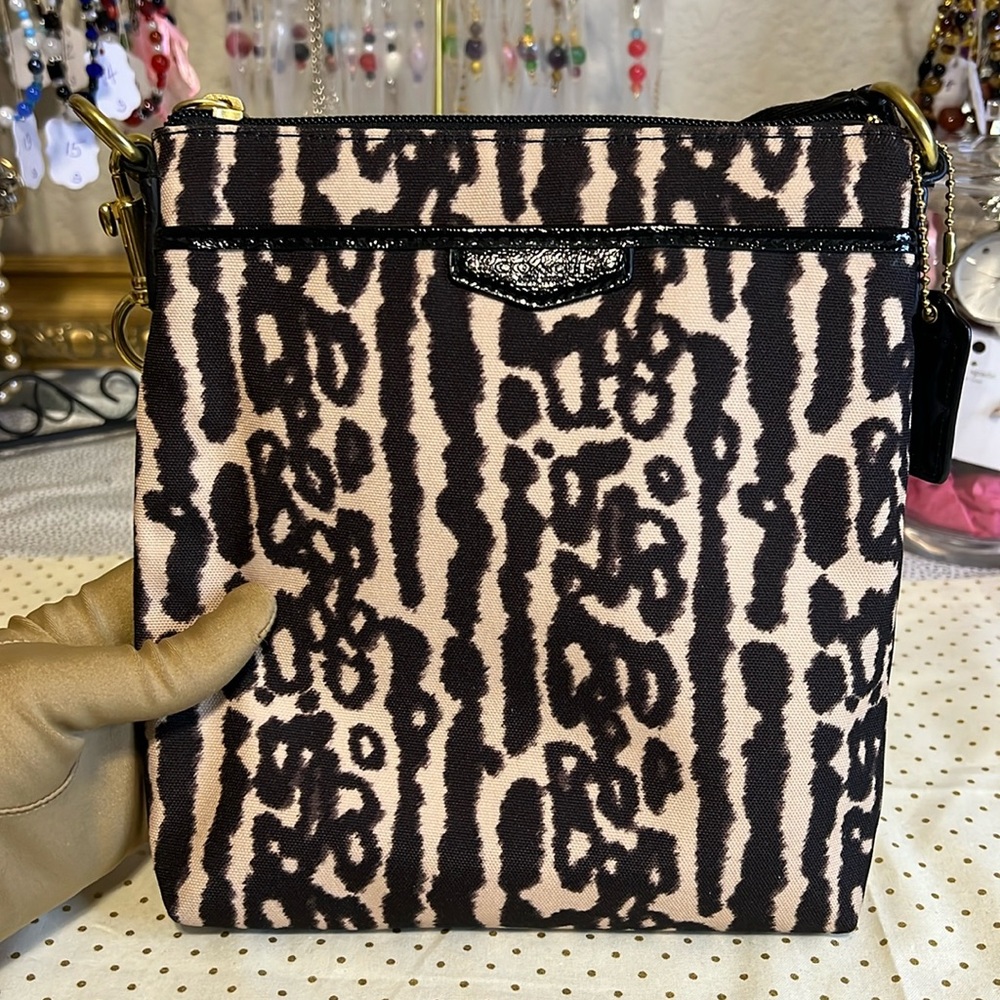 Coach crossbody style swing pack with animal print pattern